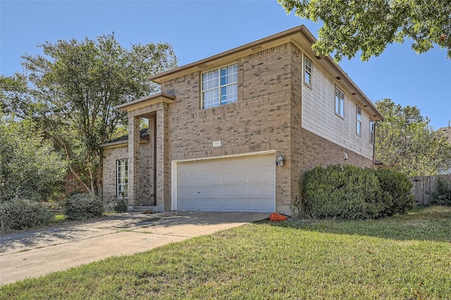 view of front of property with a garage and a front lawn