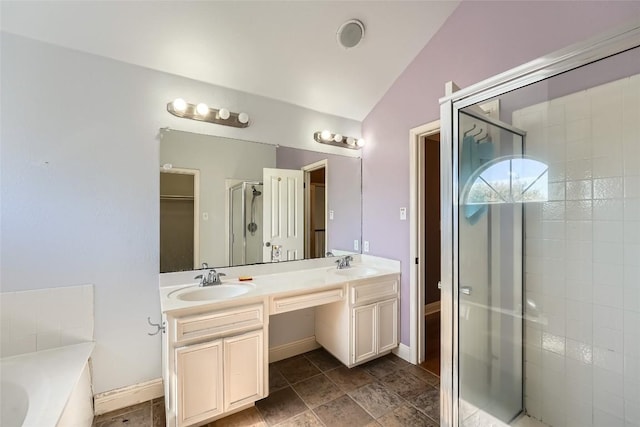 bathroom with vanity, lofted ceiling, and shower with separate bathtub