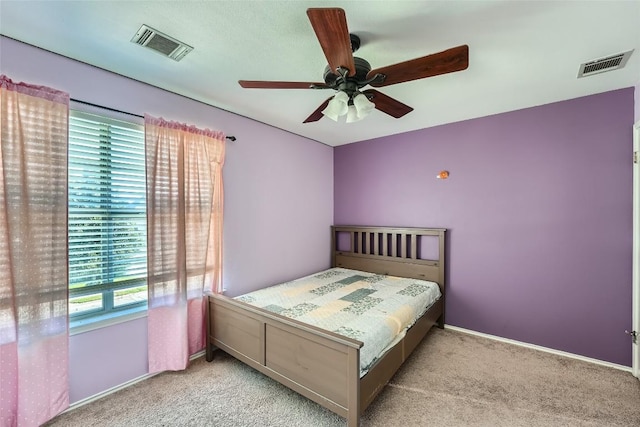 unfurnished bedroom featuring ceiling fan and light carpet