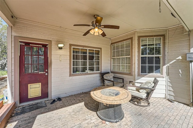 view of patio featuring ceiling fan