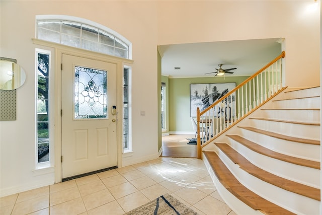 tiled foyer entrance with ceiling fan