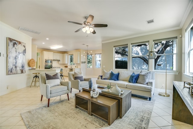 living room with crown molding, light tile patterned floors, and ceiling fan with notable chandelier