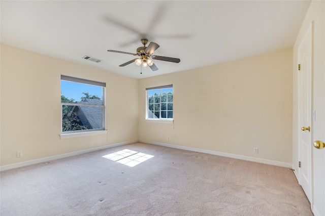 carpeted empty room with ceiling fan