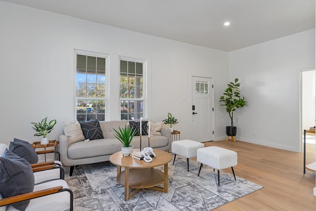 1207 Lexington St, Taylor, TX 76574 - living room with light wood-style floors, baseboards, and recessed lighting