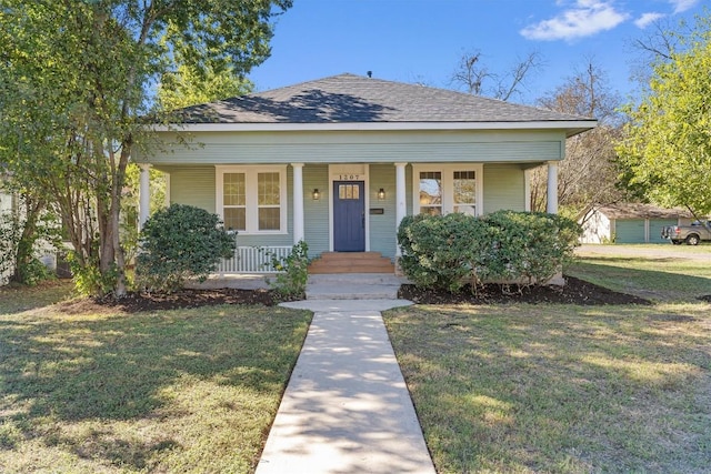 bungalow-style home featuring a porch and a front lawn