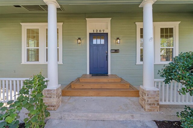 1207 Lexington St, Taylor, TX 76574 - doorway to property with a porch