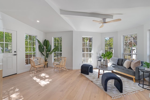 sunroom / solarium with ceiling fan and beamed ceiling