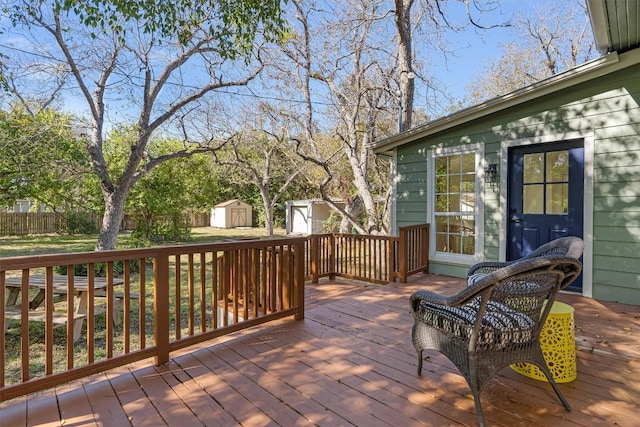 1207 Lexington St, Taylor, TX 76574 - deck featuring a shed, an outbuilding, and fence