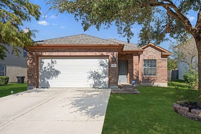 single story home with a garage and a front lawn