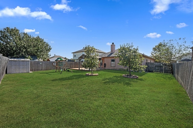 view of yard with a playground