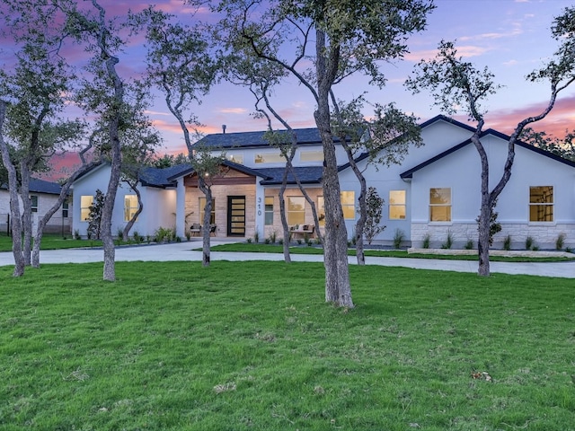 view of front of property with a yard