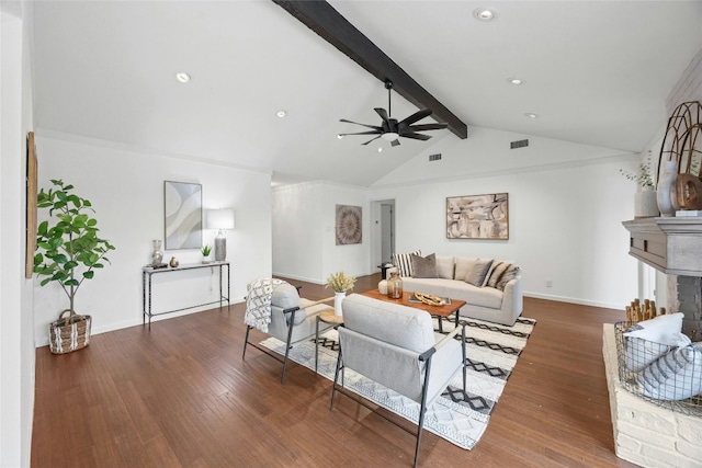 living room featuring lofted ceiling with beams, ceiling fan, dark wood-style flooring, a fireplace, and visible vents