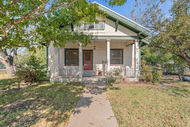 bungalow featuring a front yard and a porch