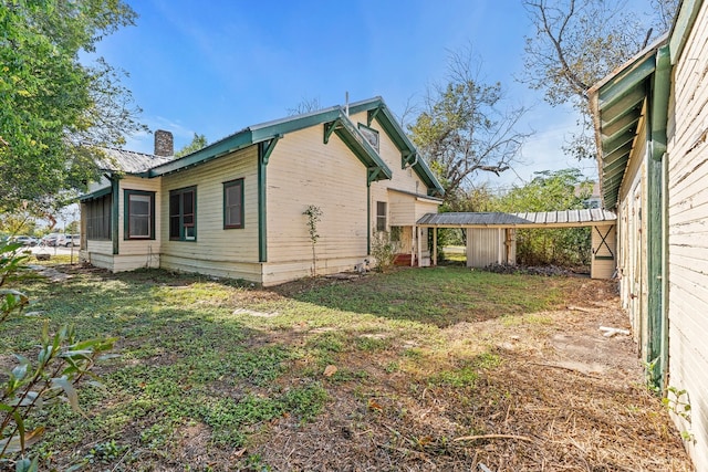 view of property exterior with a lawn