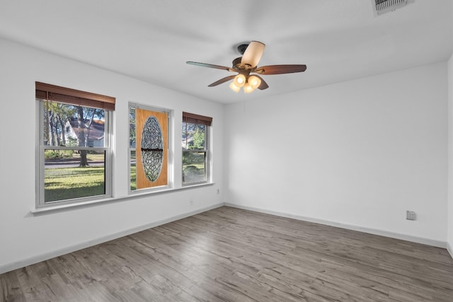 unfurnished room featuring hardwood / wood-style flooring and ceiling fan