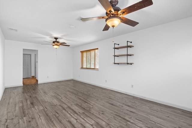 unfurnished room featuring hardwood / wood-style floors and ceiling fan