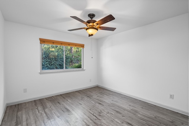 unfurnished room featuring ceiling fan and light hardwood / wood-style flooring