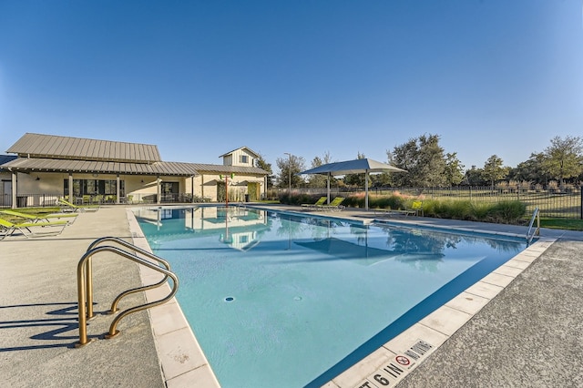 view of swimming pool with a patio