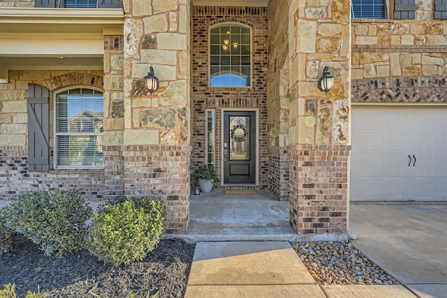 view of exterior entry featuring a garage