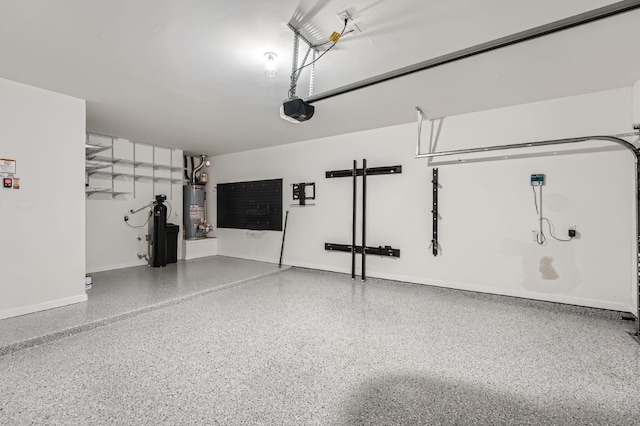 garage featuring gas water heater and a garage door opener