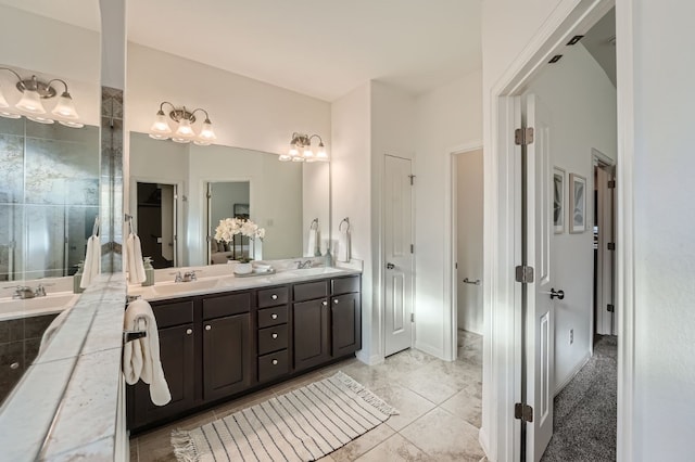 bathroom featuring tile patterned flooring and vanity