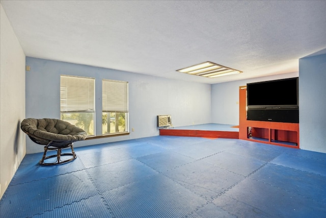 unfurnished room with a textured ceiling