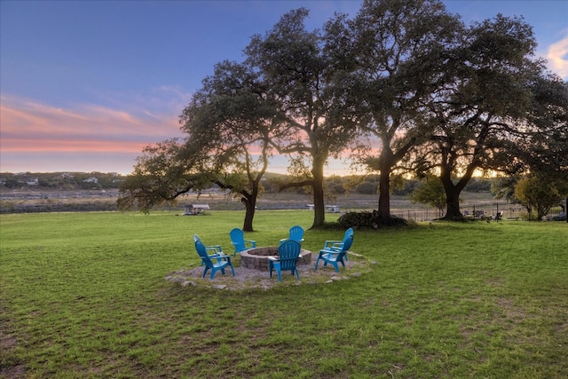 yard at dusk with an outdoor fire pit