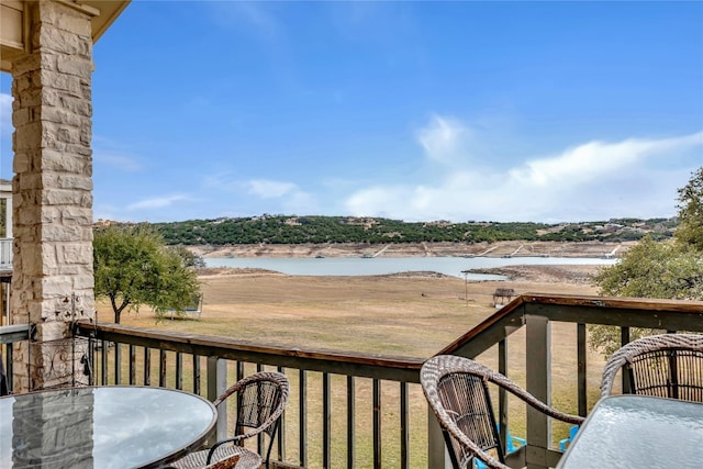 balcony featuring a water view