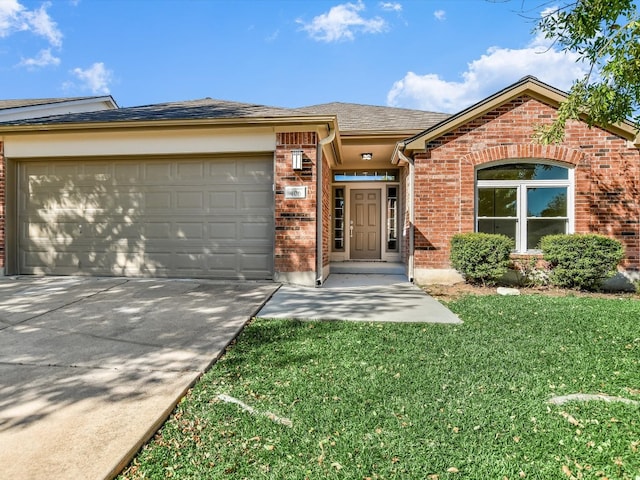 view of front of house with a garage and a front lawn