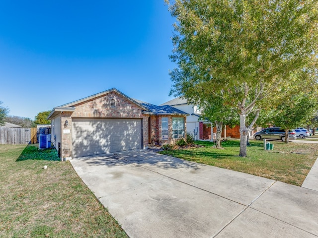 ranch-style house with fence, concrete driveway, brick siding, a front yard, and a garage
