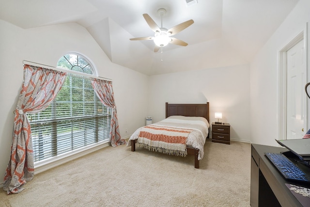 carpeted bedroom with ceiling fan and lofted ceiling