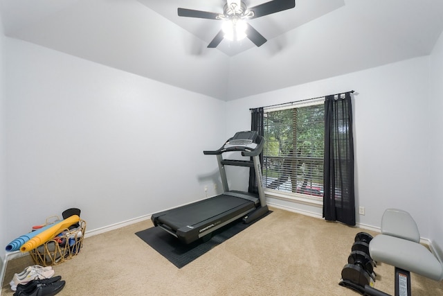 workout room featuring ceiling fan, carpet floors, and lofted ceiling