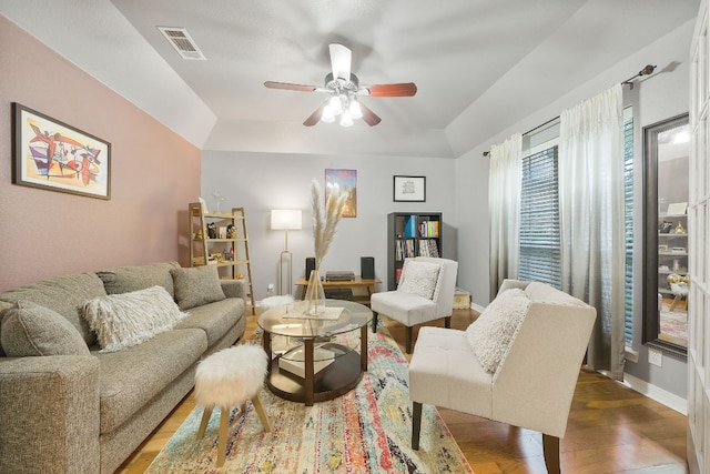 living room featuring ceiling fan and hardwood / wood-style floors