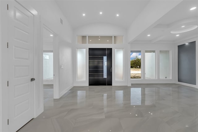 foyer entrance with lofted ceiling