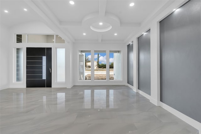 foyer entrance featuring beam ceiling and coffered ceiling