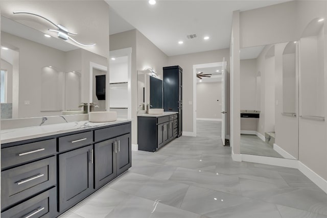 bathroom with ceiling fan and vanity