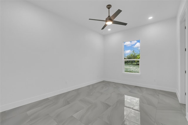 unfurnished room with ceiling fan