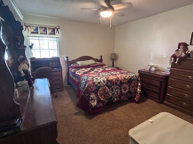 bedroom featuring dark colored carpet, a textured ceiling, and ceiling fan