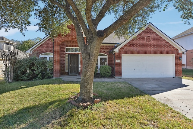 view of front property with a front lawn and a garage