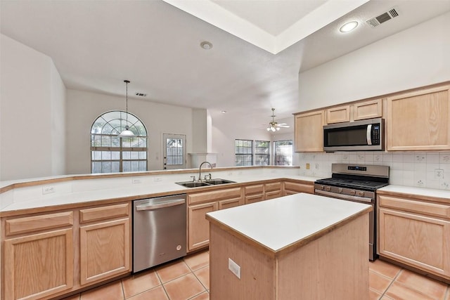 kitchen with light brown cabinets, sink, ceiling fan, light tile patterned floors, and appliances with stainless steel finishes