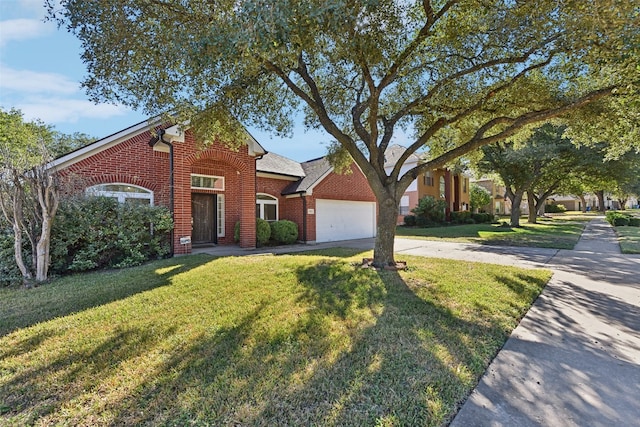 view of front of home with a garage and a front lawn