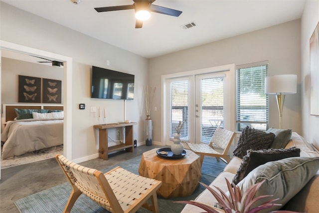 living room with french doors and ceiling fan