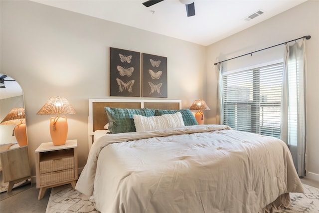 bedroom with ceiling fan and light colored carpet