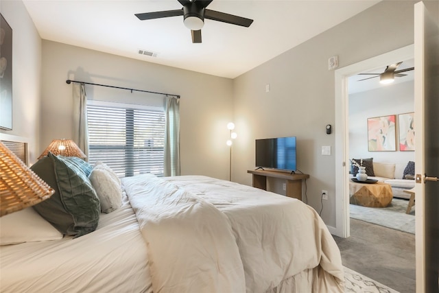 carpeted bedroom with ceiling fan