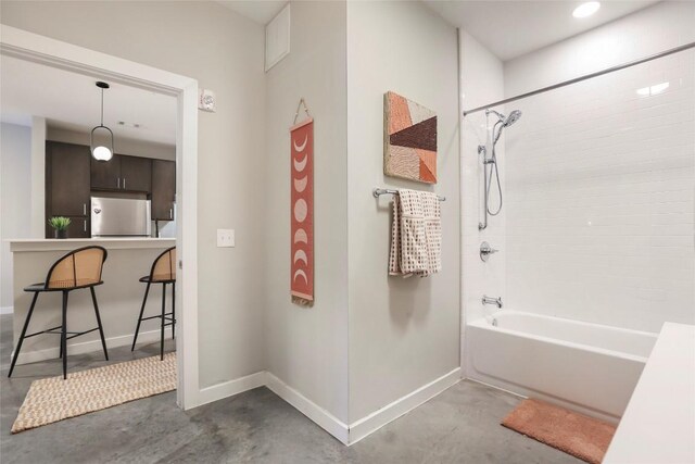 2505 Thornton Rd Unit 1103, Austin, TX 78704 - bathroom featuring concrete floors, tub / shower combination, and baseboards