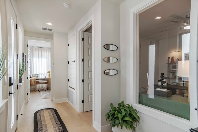 bathroom featuring hardwood / wood-style floors and ceiling fan