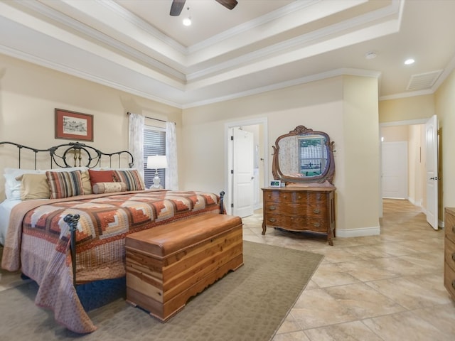 bedroom featuring a tray ceiling, ceiling fan, and ornamental molding