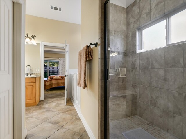 bathroom with vanity and an enclosed shower