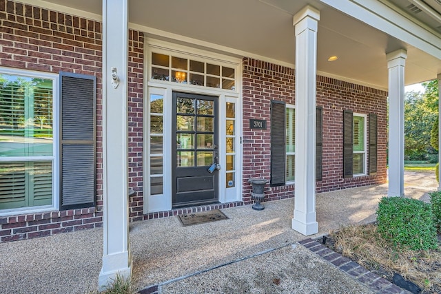 doorway to property with a porch