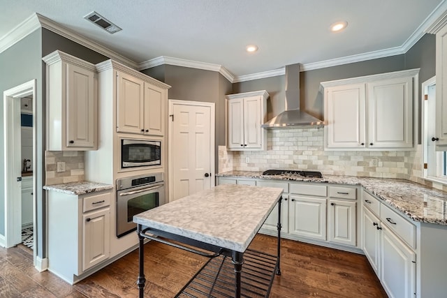 kitchen featuring white cabinets, wall chimney exhaust hood, stainless steel appliances, and dark hardwood / wood-style floors